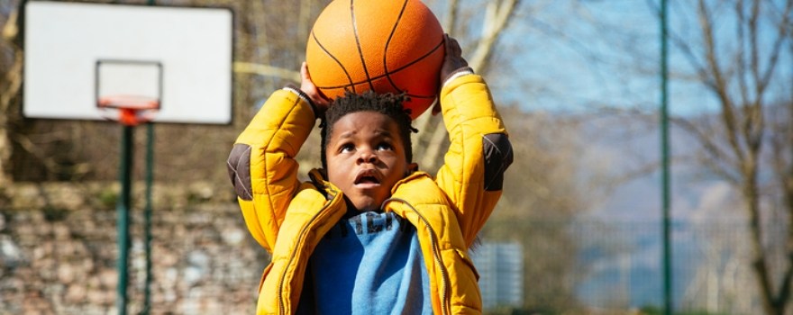 Boy plays basketball during Midwinter break Staten Island