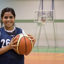 Young girl with basketball.