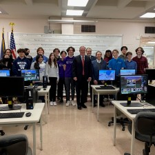 a group photo of students with local officials.