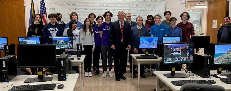 a group photo of students with local officials.