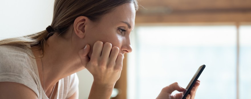 Woman looking at her phone.