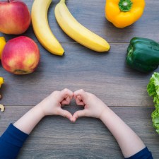 an array of healthy foods, which are part of NYC's plan for improving food education in NYC schools, spread out on a table