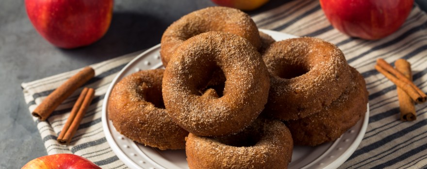 a plate of apple cider donuts similar to apple cider donuts on Staten Island that can be purchased in several places