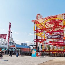 Amusement park rides during the day, showing where Halloween Harvest at Luna Park will take place