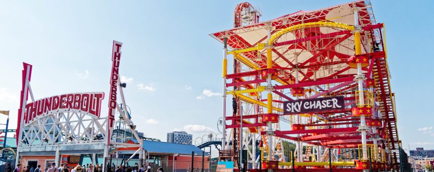 Amusement park rides during the day, showing where Halloween Harvest at Luna Park will take place